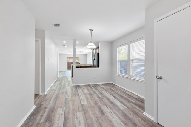 132 Grazing Horse Ln, Manchaca, TX 78652 - unfurnished dining area with baseboards, visible vents, wood finished floors, and recessed lighting