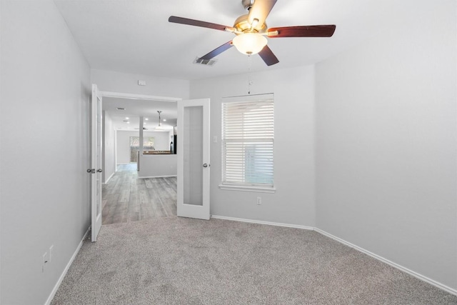 132 Grazing Horse Ln, Manchaca, TX 78652 - carpeted spare room with baseboards, ceiling fan, and visible vents