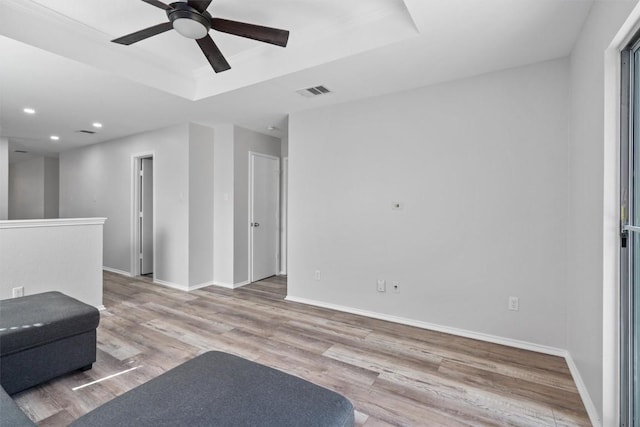 132 Grazing Horse Ln, Manchaca, TX 78652 - interior space with visible vents, baseboards, ceiling fan, wood finished floors, and a raised ceiling