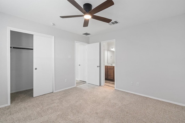 132 Grazing Horse Ln, Manchaca, TX 78652 - unfurnished bedroom with a closet, baseboards, visible vents, and light carpet