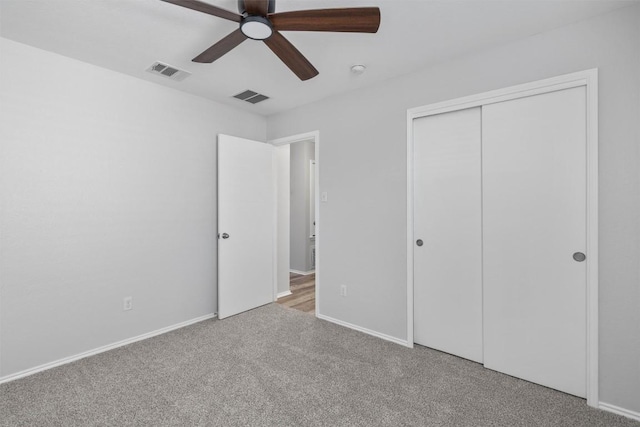 132 Grazing Horse Ln, Manchaca, TX 78652 - unfurnished bedroom featuring baseboards, visible vents, a closet, and carpet