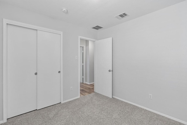 132 Grazing Horse Ln, Manchaca, TX 78652 - unfurnished bedroom with baseboards, carpet, a closet, and visible vents