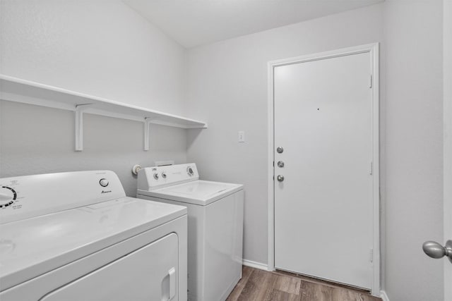 132 Grazing Horse Ln, Manchaca, TX 78652 - clothes washing area with wood finished floors, laundry area, and washer and clothes dryer