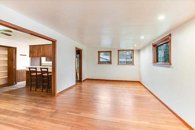 100 E Lisa Dr, Austin, TX 78752 - unfurnished living room featuring light wood-style floors, recessed lighting, and a ceiling fan