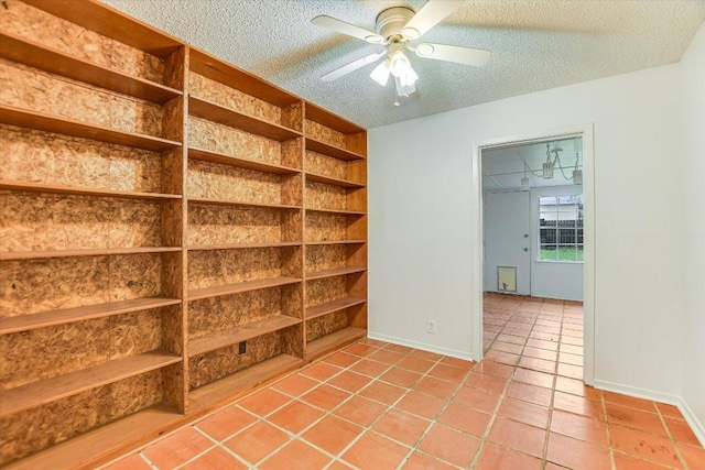 100 E Lisa Dr, Austin, TX 78752 - spare room with a textured ceiling, a ceiling fan, and light tile patterned floors