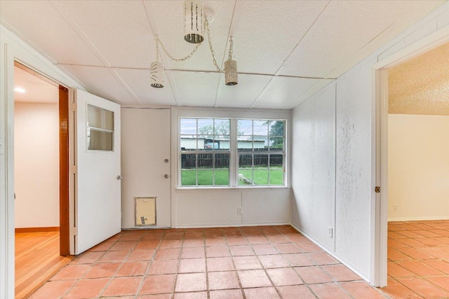 100 E Lisa Dr, Austin, TX 78752 - unfurnished room featuring a textured ceiling and light tile patterned floors