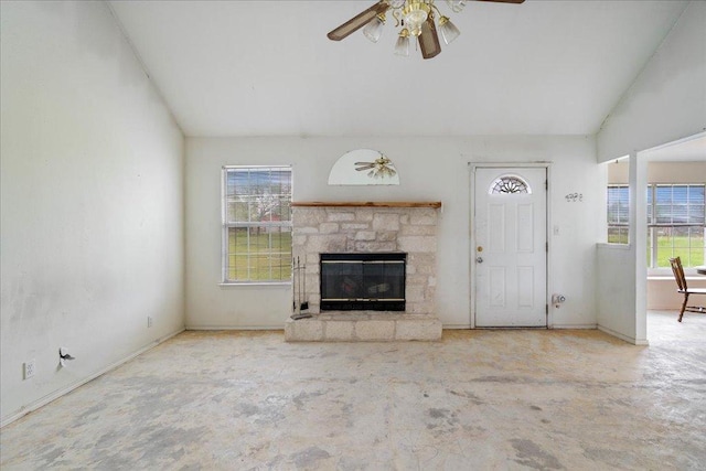 182 Lake Front Dr, Cedar Creek, TX 78612 - unfurnished living room with ceiling fan, a stone fireplace, lofted ceiling, and concrete floors