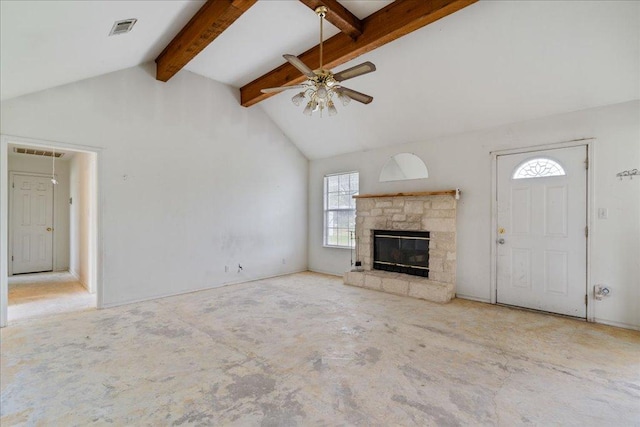 182 Lake Front Dr, Cedar Creek, TX 78612 - unfurnished living room with a ceiling fan, beam ceiling, a stone fireplace, and high vaulted ceiling