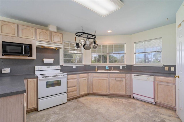 182 Lake Front Dr, Cedar Creek, TX 78612 - kitchen featuring white appliances, light brown cabinetry, and under cabinet range hood