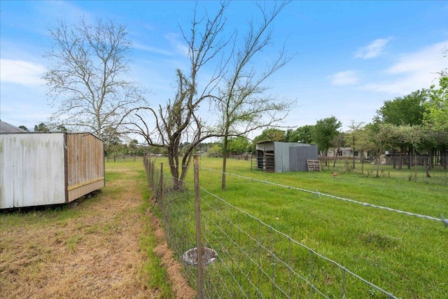 182 Lake Front Dr, Cedar Creek, TX 78612 - view of yard with an outdoor structure, a pole building, and a view of countryside