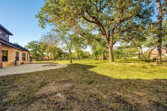455 Rose Blossom Loop, La Vernia, TX 78121 - view of grassy yard with a patio area