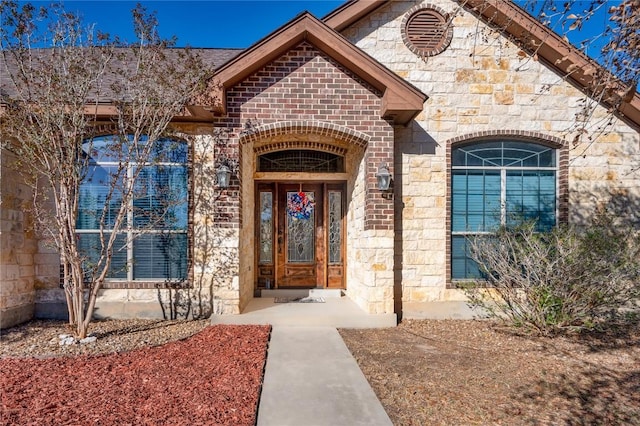 455 Rose Blossom Loop, La Vernia, TX 78121 - view of exterior entry with stone siding and brick siding