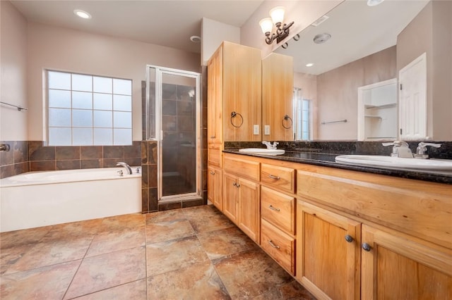 455 Rose Blossom Loop, La Vernia, TX 78121 - bathroom featuring a stall shower, double vanity, and a garden tub