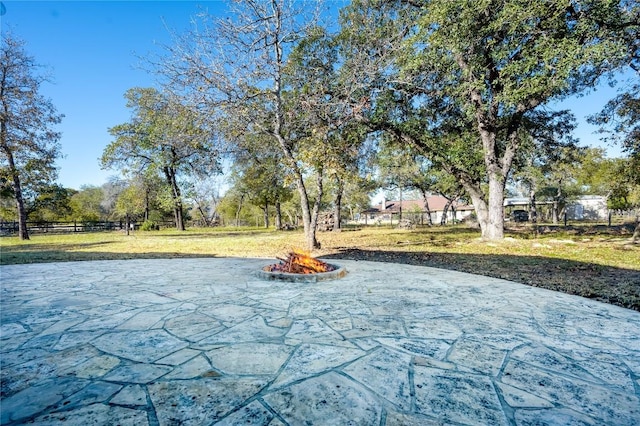 455 Rose Blossom Loop, La Vernia, TX 78121 - view of property's community with an outdoor fire pit and a patio