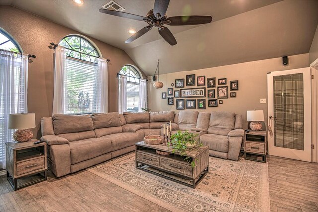 2921 Olympia Dr, Temple, TX 76502 - living room with lofted ceiling, recessed lighting, ceiling fan, visible vents, and wood finished floors
