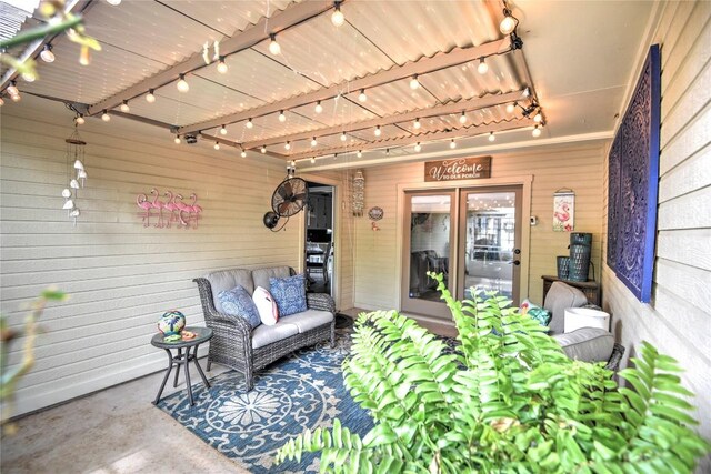 2921 Olympia Dr, Temple, TX 76502 - living room featuring wooden walls, concrete floors, and track lighting