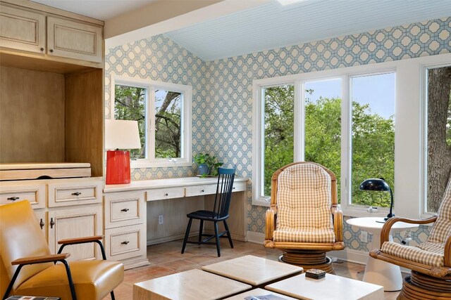 3608 Edgemont Dr, Austin, TX 78731 - sitting room featuring wallpapered walls, built in desk, and light tile patterned floors