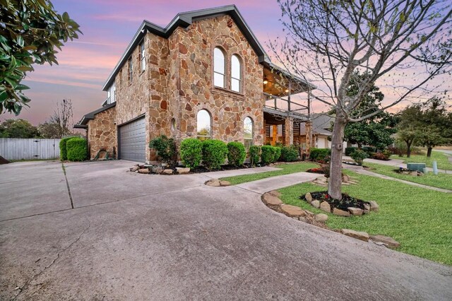 740 Nelson Ranch Rd, Cedar Park, TX 78613 - view of front of house featuring stone siding, driveway, and a balcony