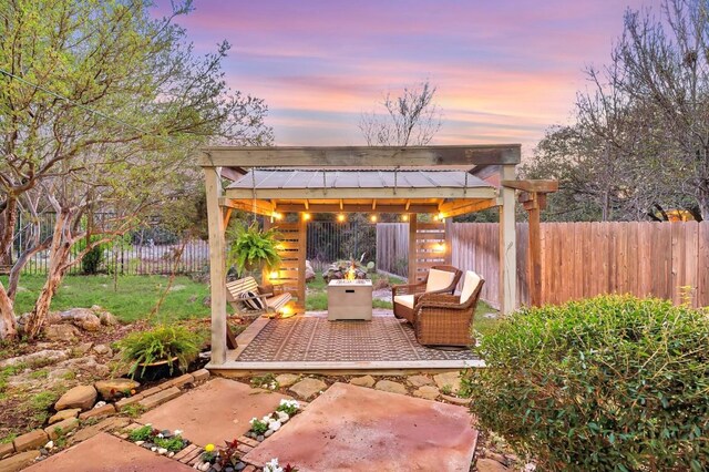 740 Nelson Ranch Rd, Cedar Park, TX 78613 - patio terrace at dusk with a gazebo, a fenced backyard, and a patio