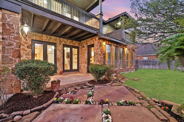 740 Nelson Ranch Rd, Cedar Park, TX 78613 - entrance to property featuring french doors, stone siding, a balcony, and a patio