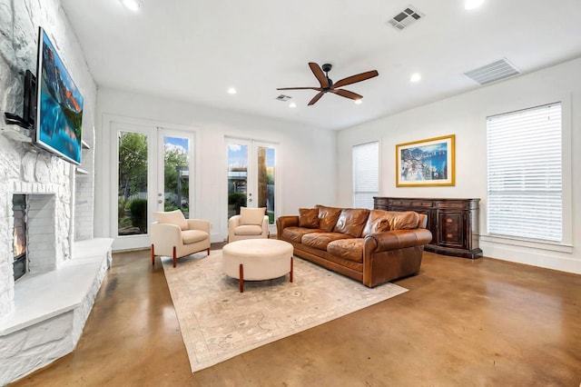 740 Nelson Ranch Rd, Cedar Park, TX 78613 - living area with finished concrete flooring, recessed lighting, a stone fireplace, and ceiling fan