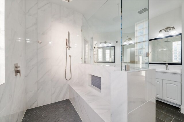 740 Nelson Ranch Rd, Cedar Park, TX 78613 - bathroom featuring a marble finish shower, vanity, healthy amount of natural light, and tile patterned flooring