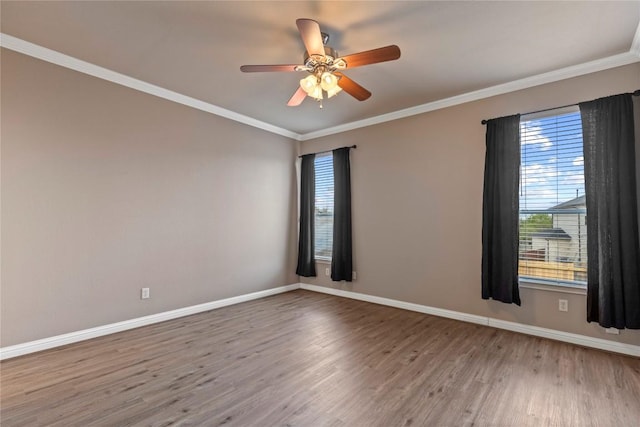 1628 Hidden Springs Path, Round Rock, TX 78665 - unfurnished room featuring wood finished floors, plenty of natural light, baseboards, ceiling fan, and crown molding