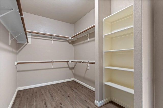 1628 Hidden Springs Path, Round Rock, TX 78665 - walk in closet featuring wood finished floors