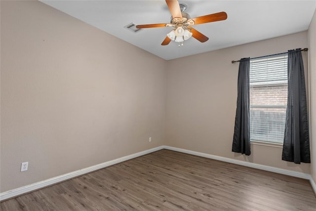 1628 Hidden Springs Path, Round Rock, TX 78665 - empty room featuring wood finished floors, baseboards, and ceiling fan