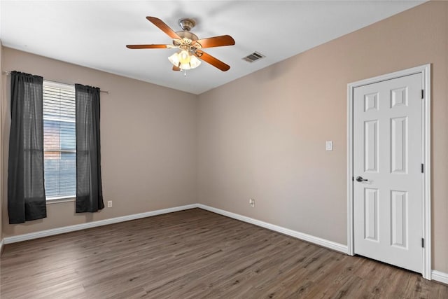 1628 Hidden Springs Path, Round Rock, TX 78665 - unfurnished room with ceiling fan, wood finished floors, and baseboards