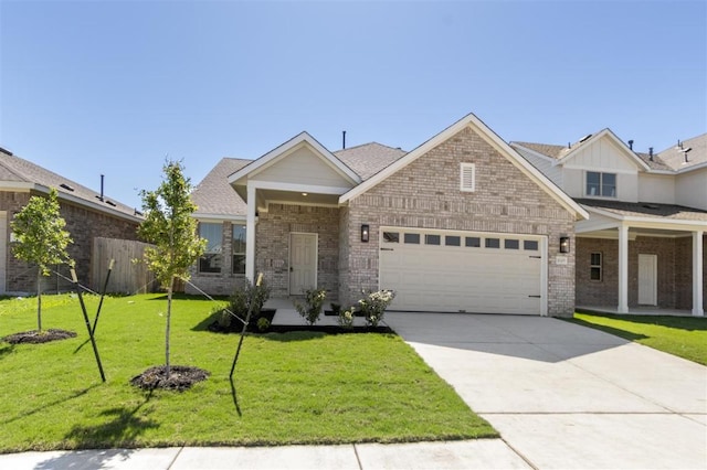 18309 Emu Ln, Manor, TX 78653 - view of front of home featuring a garage, concrete driveway, and brick siding