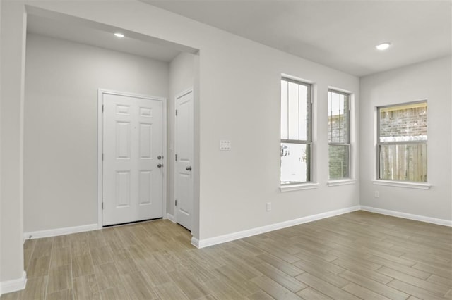 18309 Emu Ln, Manor, TX 78653 - foyer featuring wood finished floors, baseboards, and recessed lighting