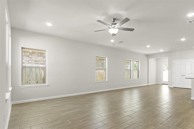 18309 Emu Ln, Manor, TX 78653 - empty room with recessed lighting, ceiling fan, wood finished floors, and baseboards