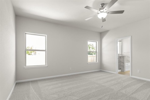 18309 Emu Ln, Manor, TX 78653 - unfurnished bedroom featuring carpet flooring, baseboards, ensuite bath, and ceiling fan