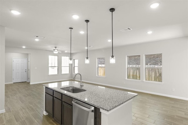 18309 Emu Ln, Manor, TX 78653 - kitchen featuring a sink, dishwasher, open floor plan, light wood-style floors, and ceiling fan