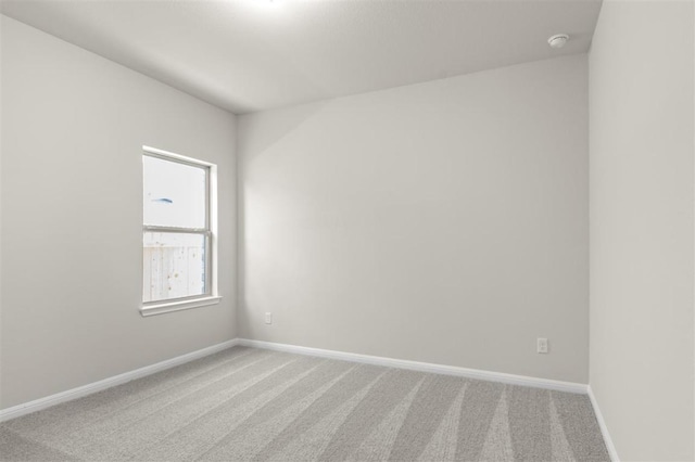 18309 Emu Ln, Manor, TX 78653 - carpeted spare room with baseboards and a smoke detector