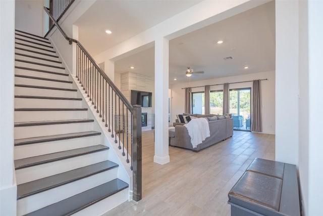 121 Black Talon Ln, Cedar Creek, TX 78612 - staircase with a ceiling fan, recessed lighting, baseboards, and wood finished floors