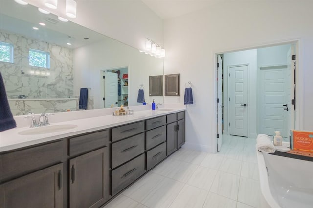 121 Black Talon Ln, Cedar Creek, TX 78612 - full bath featuring double vanity, a closet, a shower, a soaking tub, and tile patterned flooring