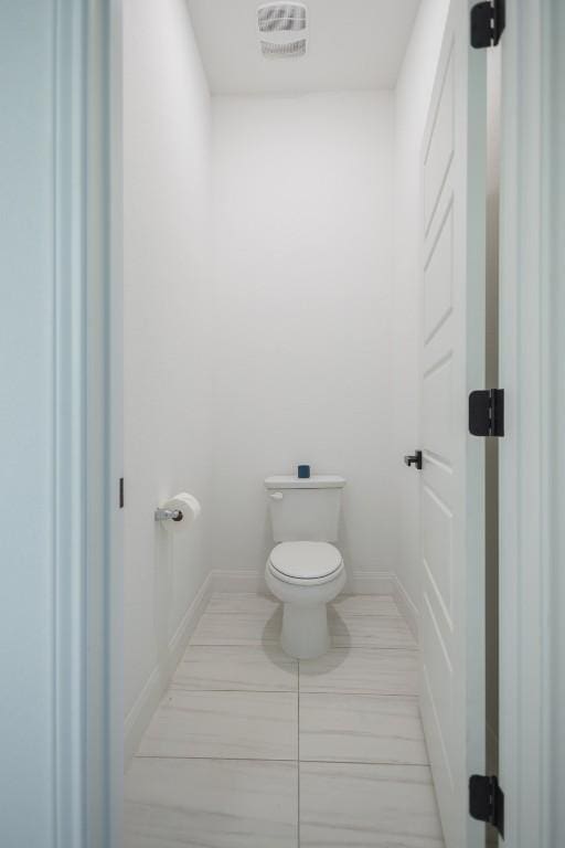 121 Black Talon Ln, Cedar Creek, TX 78612 - bathroom featuring toilet and baseboards