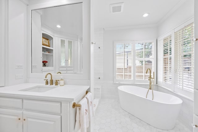 807 Terrace Mountain Dr, West Lake Hills, TX 78746 - bathroom featuring a healthy amount of sunlight, a freestanding tub, crown molding, and vanity