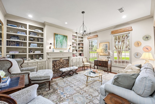 807 Terrace Mountain Dr, West Lake Hills, TX 78746 - sitting room with crown molding, a notable chandelier, a fireplace, built in features, and visible vents