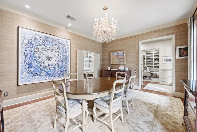 807 Terrace Mountain Dr, West Lake Hills, TX 78746 - dining area featuring crown molding, a notable chandelier, baseboards, wood finished floors, and visible vents