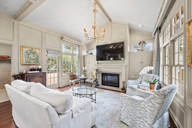807 Terrace Mountain Dr, West Lake Hills, TX 78746 - living room featuring wood finished floors, lofted ceiling with beams, a chandelier, a glass covered fireplace, and a decorative wall