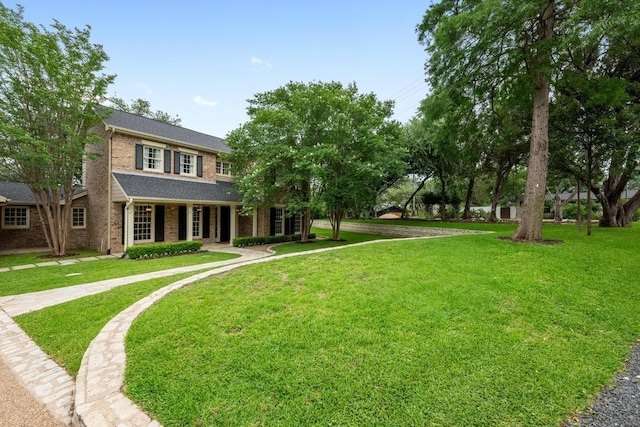 807 Terrace Mountain Dr, West Lake Hills, TX 78746 - view of front of property with brick siding, a front yard, and covered porch