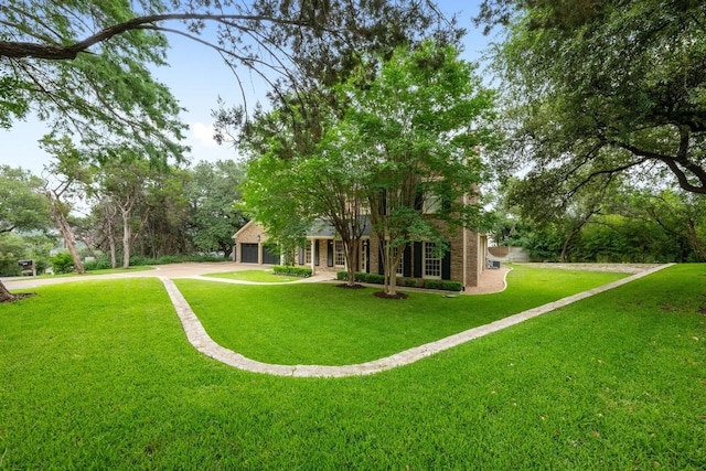 807 Terrace Mountain Dr, West Lake Hills, TX 78746 - view of green lawn featuring driveway and a garage