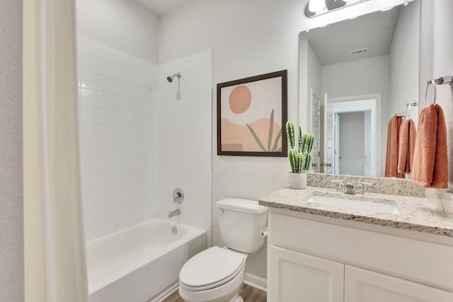 240 Hidalgo Ln, Elgin, TX 78621 - full bathroom with toilet, vanity, shower / bath combination, baseboards, and wood finished floors