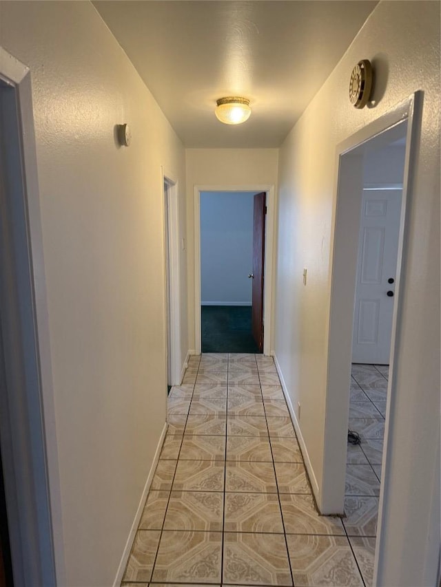 6300 Hickman Ave, Austin, TX 78723 - hallway with light tile patterned floors and baseboards