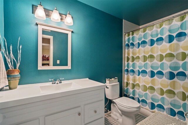 317 Venture Blvd S, Point Venture, TX 78645 - bathroom with vanity, toilet, tile patterned floors, and curtained shower