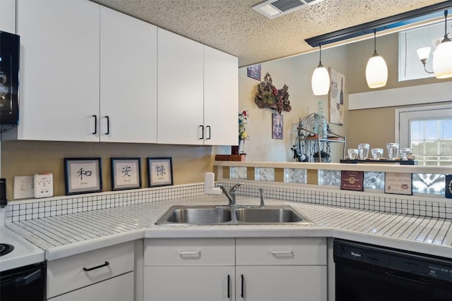 317 Venture Blvd S, Point Venture, TX 78645 - kitchen with black dishwasher, a sink, light countertops, white cabinets, and decorative light fixtures