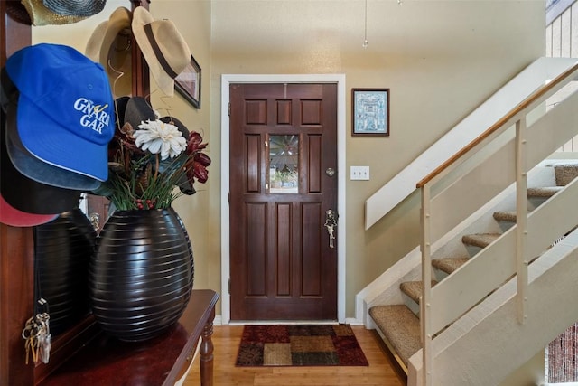 317 Venture Blvd S, Point Venture, TX 78645 - entrance foyer with stairway, wood finished floors, and baseboards